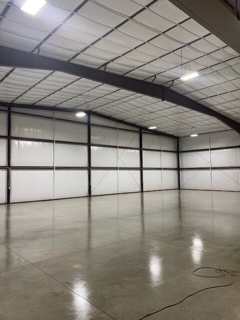 An empty warehouse with lights